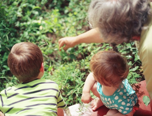Grandparent with grandchildren, photo from the back